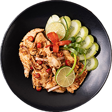 chicken larb plate with dried chilies tomatoes spring onions lettuce